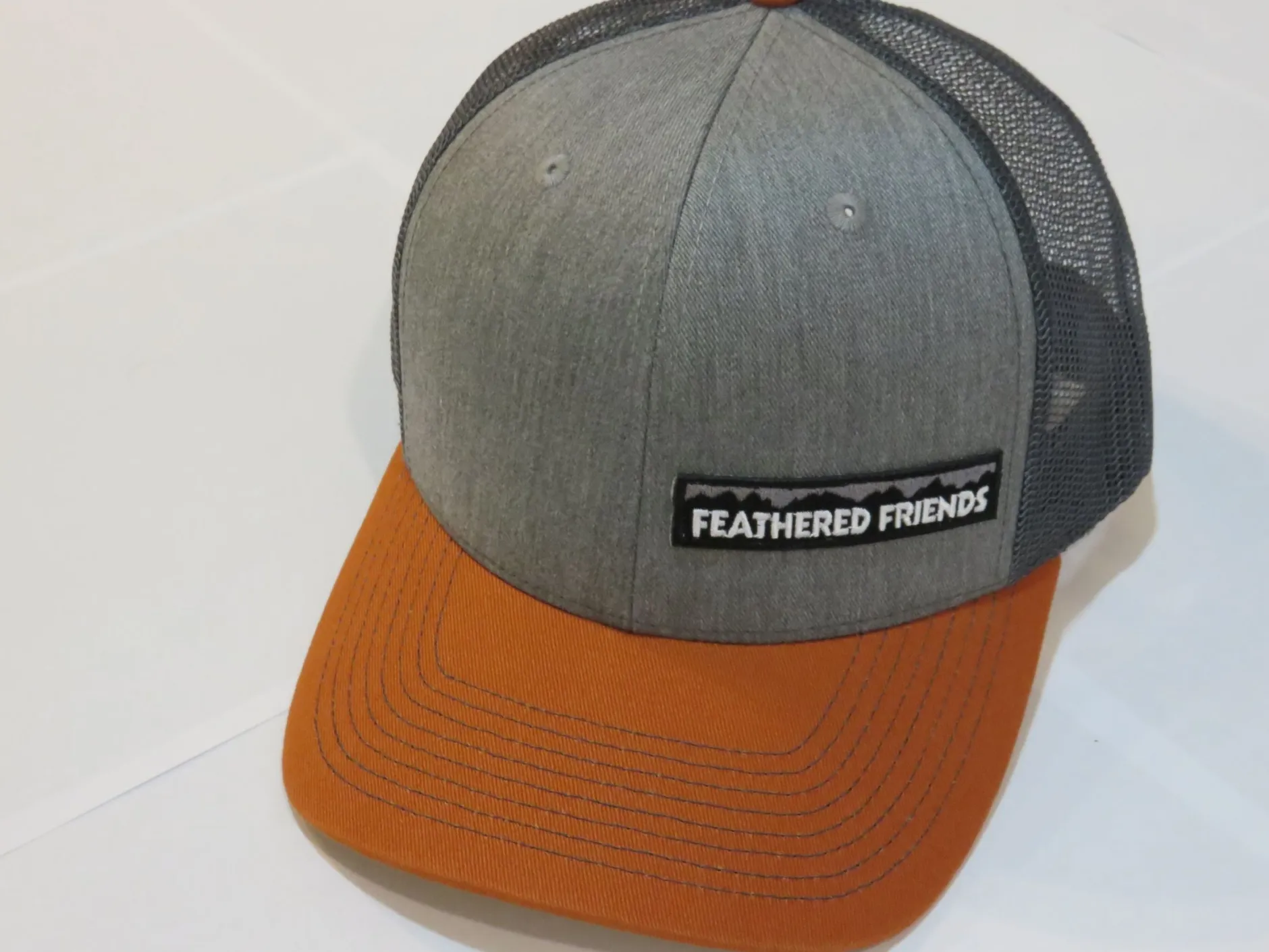 Feathered Friends Pro Style Trucker Offset Mountain Logo Patch Hat