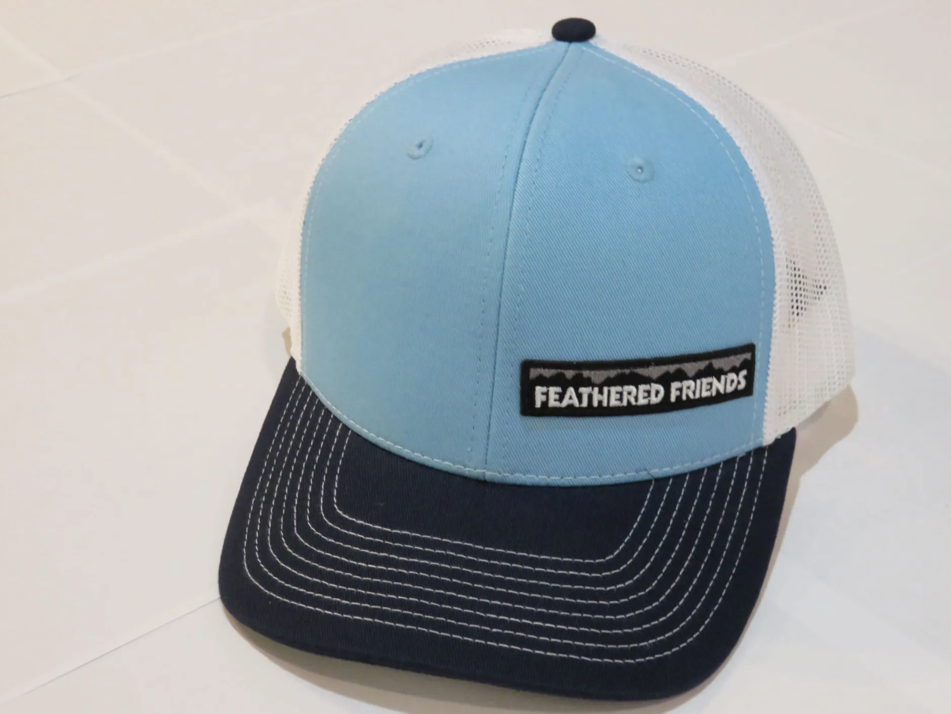 Feathered Friends Pro Style Trucker Offset Mountain Logo Patch Hat